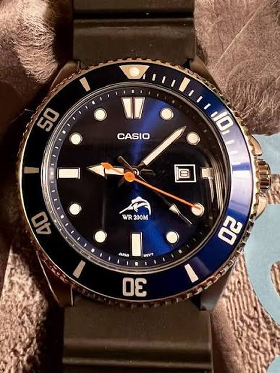 Casio Duro with black dial and blue bezel on the stock resin strap