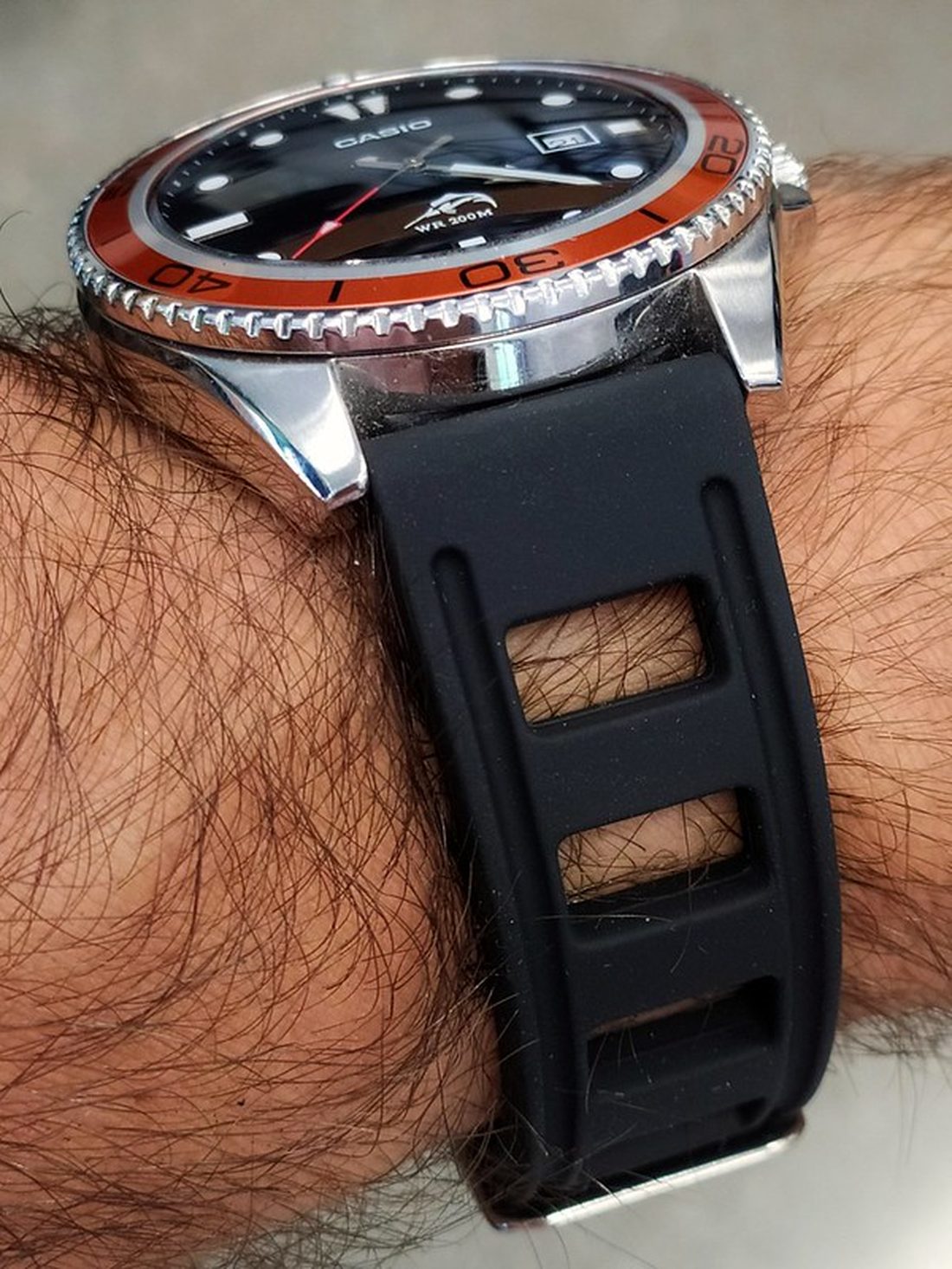 Casio Duro with a red bezel insert on a rubber strap, on the wrist